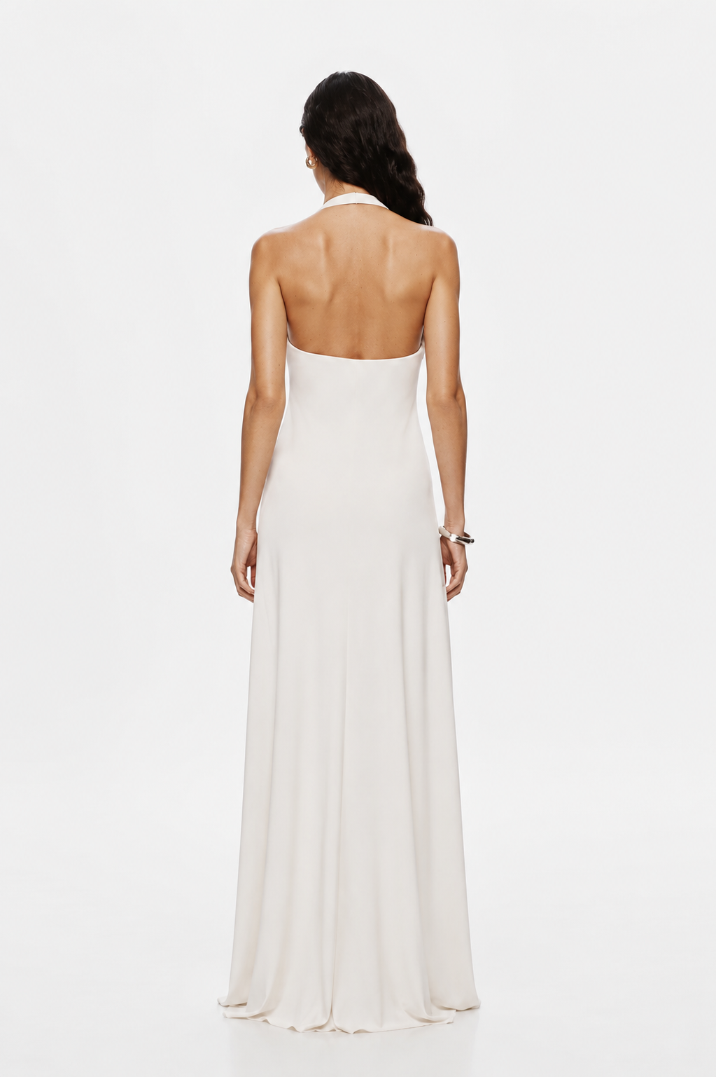 Ivory sleeveless backless maxi dress with open back and smooth drape