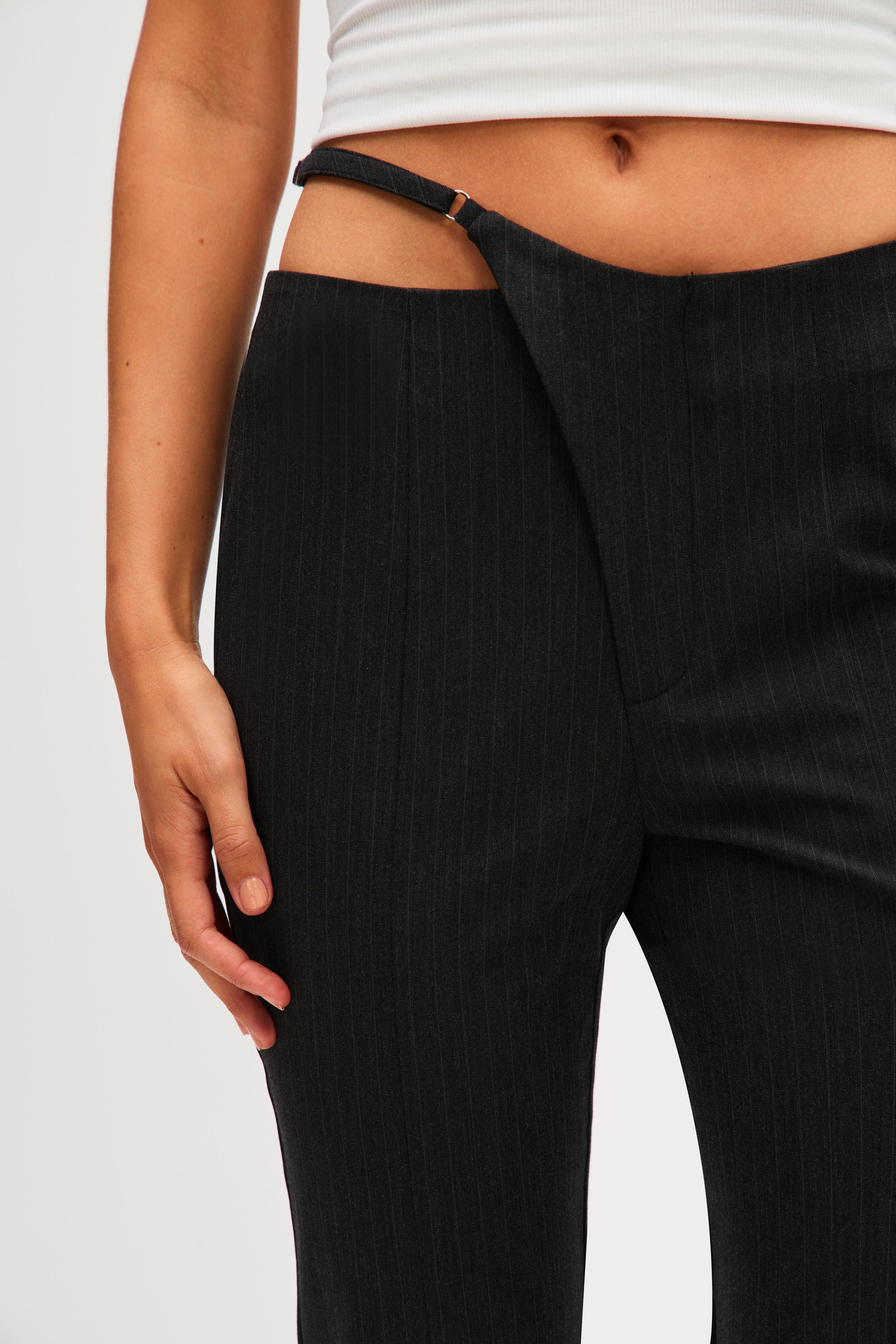 Black pinstripe pants detail with high waist and stitched center seam
