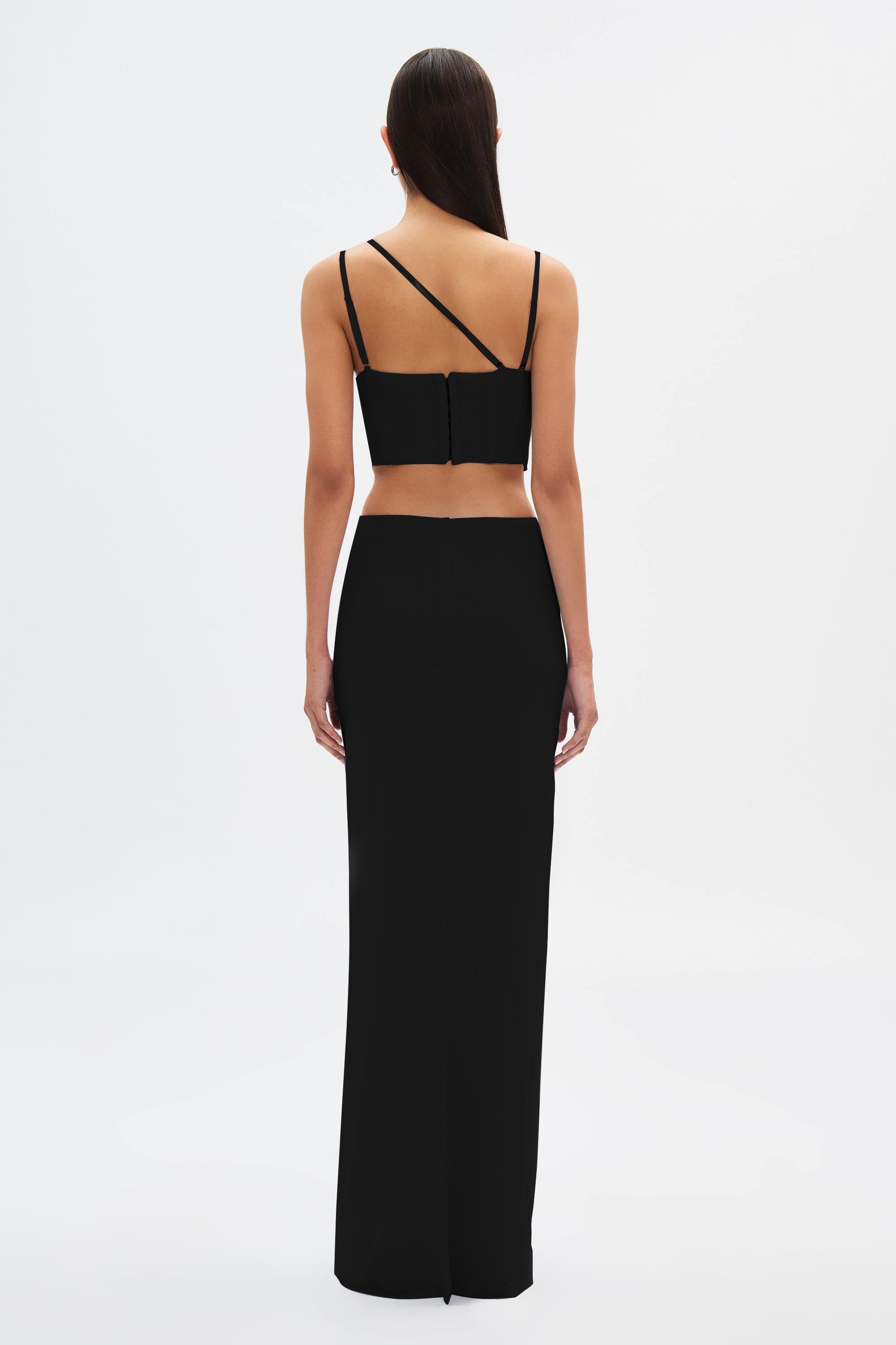 Black maxi dress back view with thin shoulder straps and structured bodice