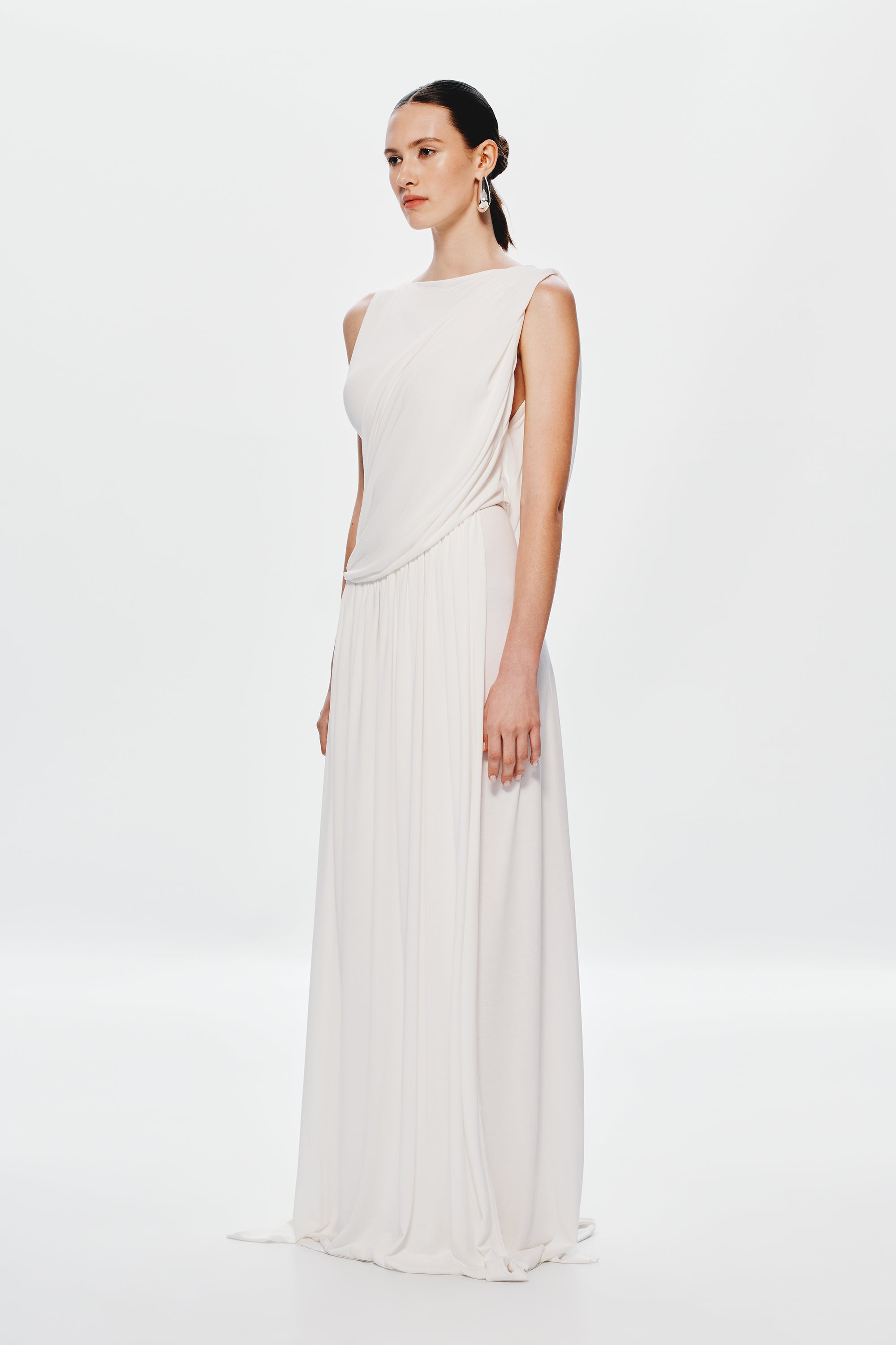 Ivory sleeveless maxi dress with draped back and gathered waist pleated skirt