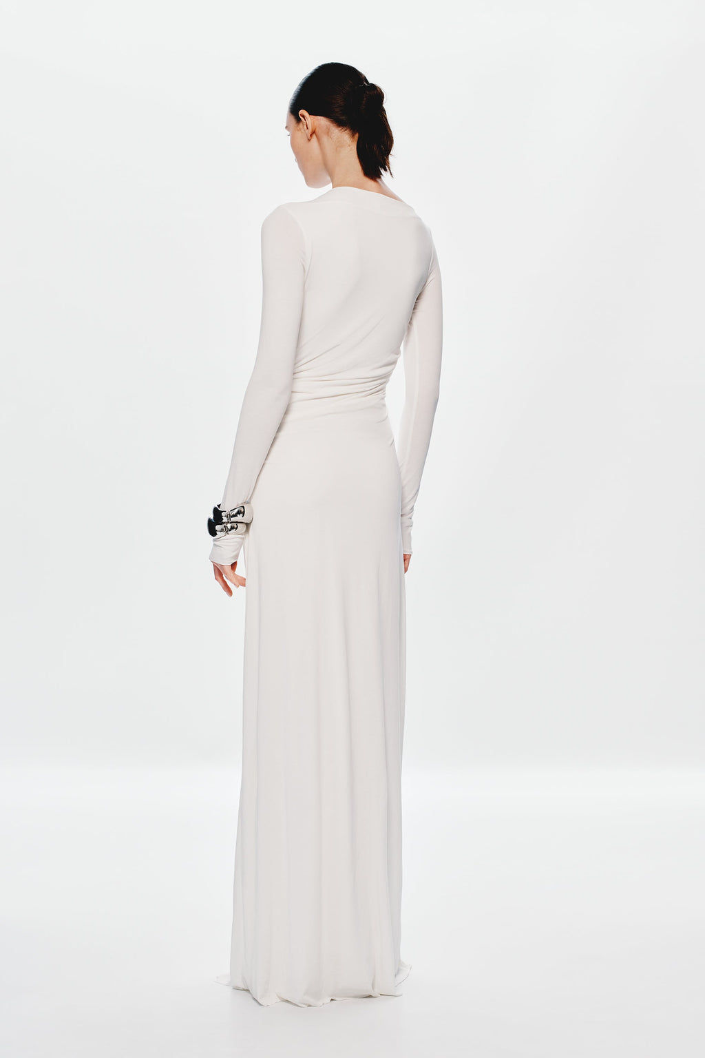Ivory long-sleeve maxi dress back view with ruched waist and draped skirt
