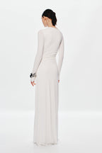 Ivory long-sleeve maxi dress back view with ruched waist and draped skirt