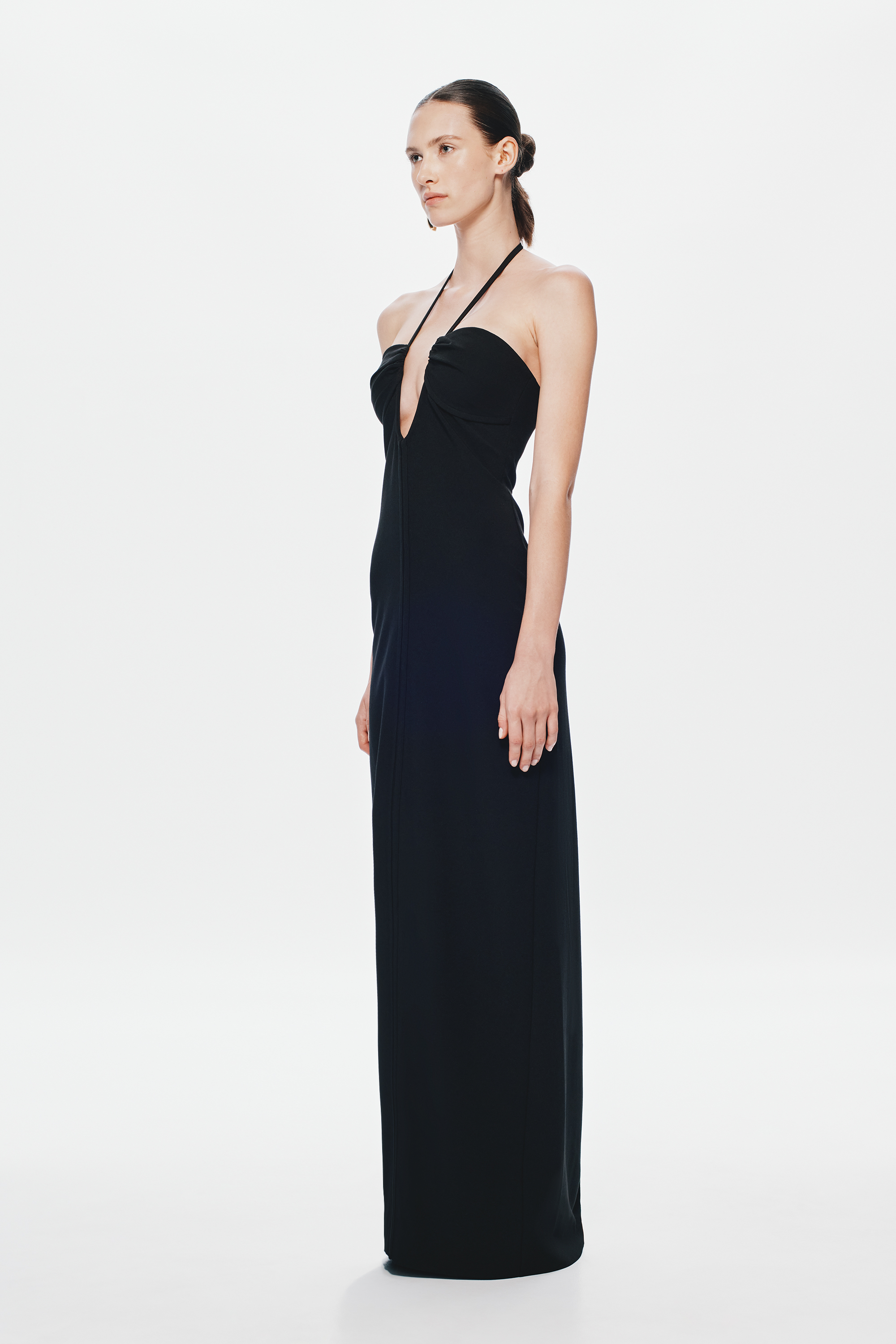 Black halter maxi dress with draped bodice and side profile, long column skirt