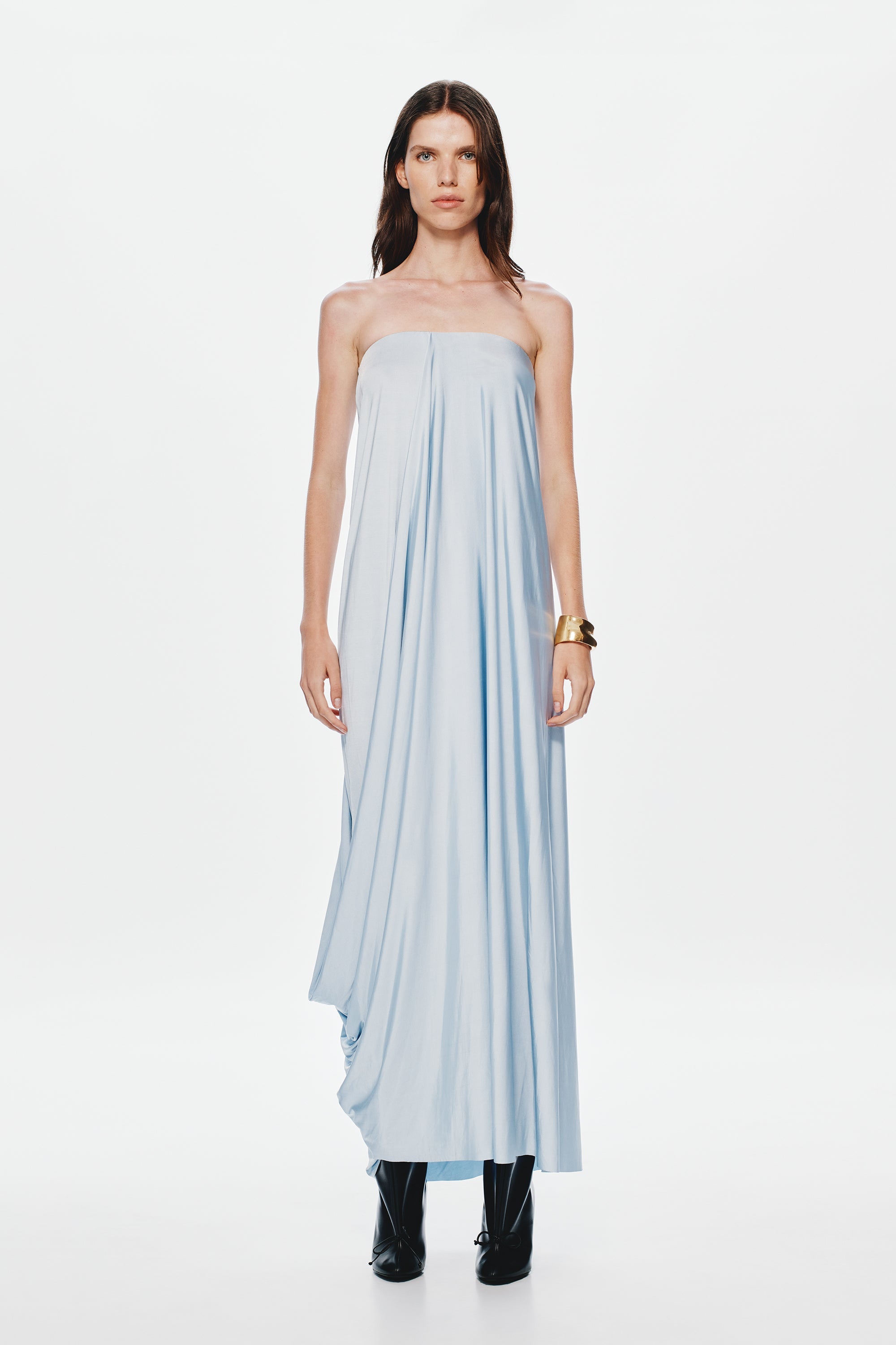 Light blue strapless maxi jersey dress with vertical pleats and draped skirt