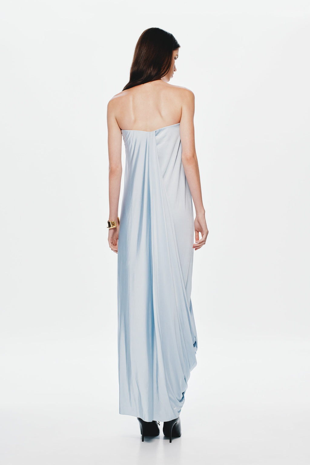 Back view light blue strapless maxi jersey dress with draped seams and long skirt