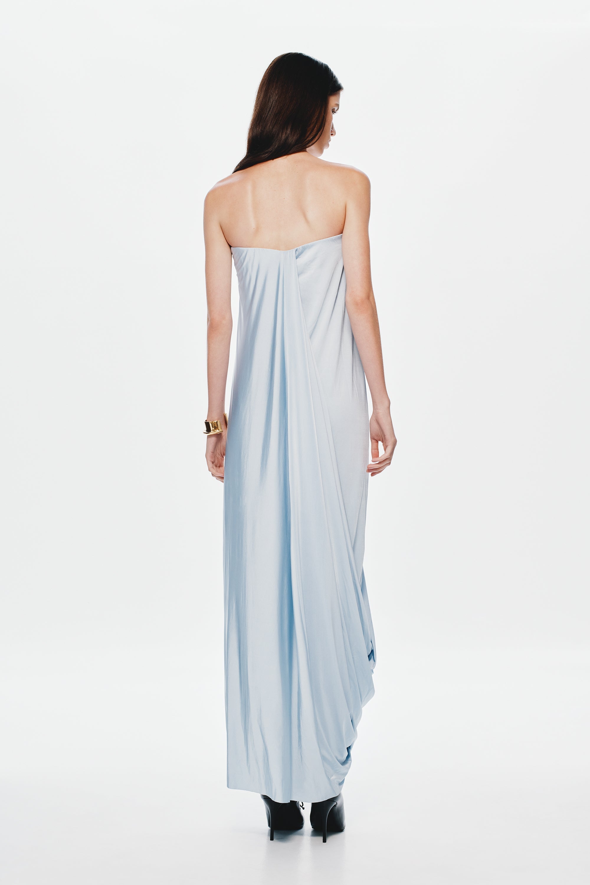 Back view light blue strapless maxi jersey dress with draped seams and long skirt