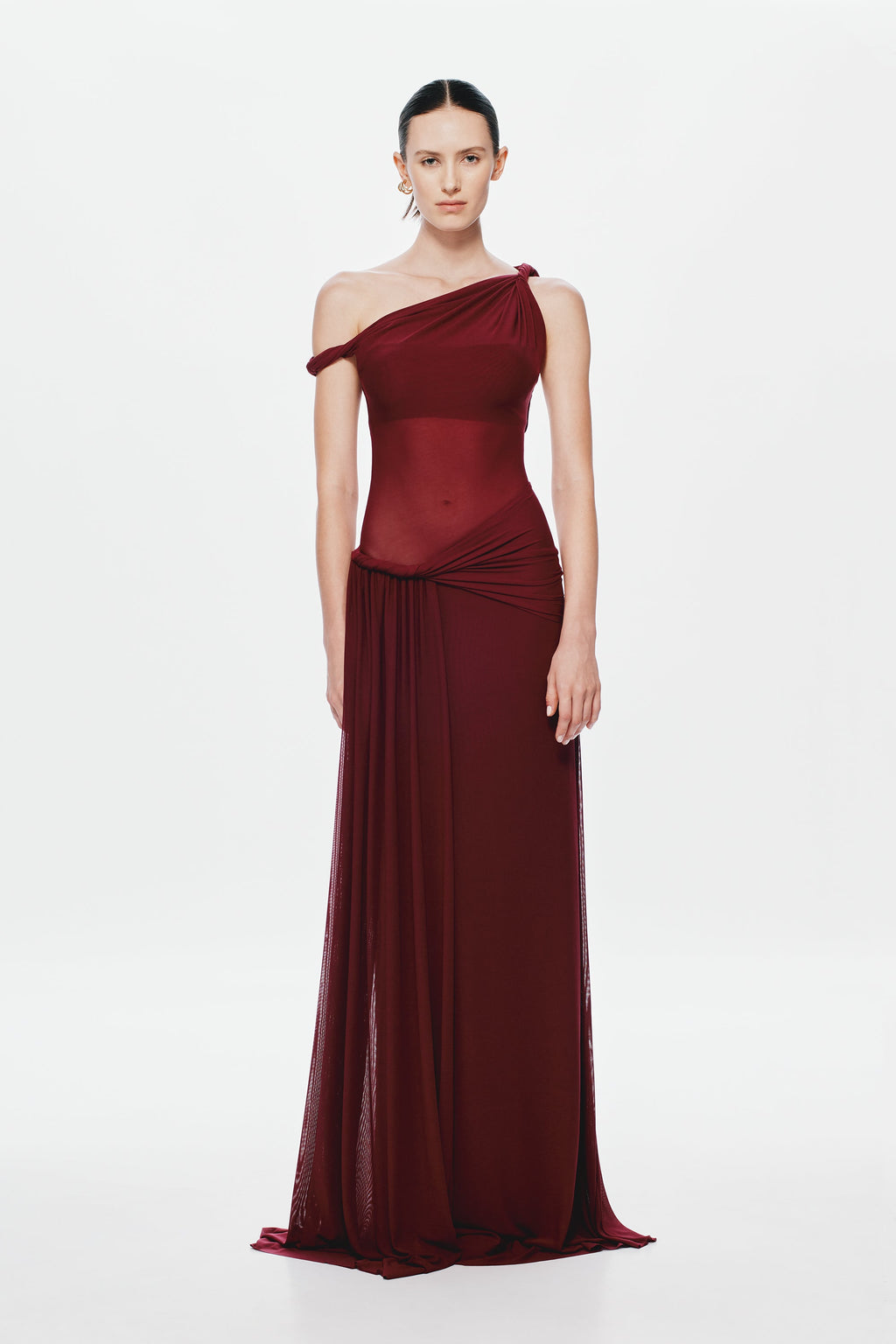 Maroon one-shoulder draped maxi dress with ruched waist and flowing sheer skirt