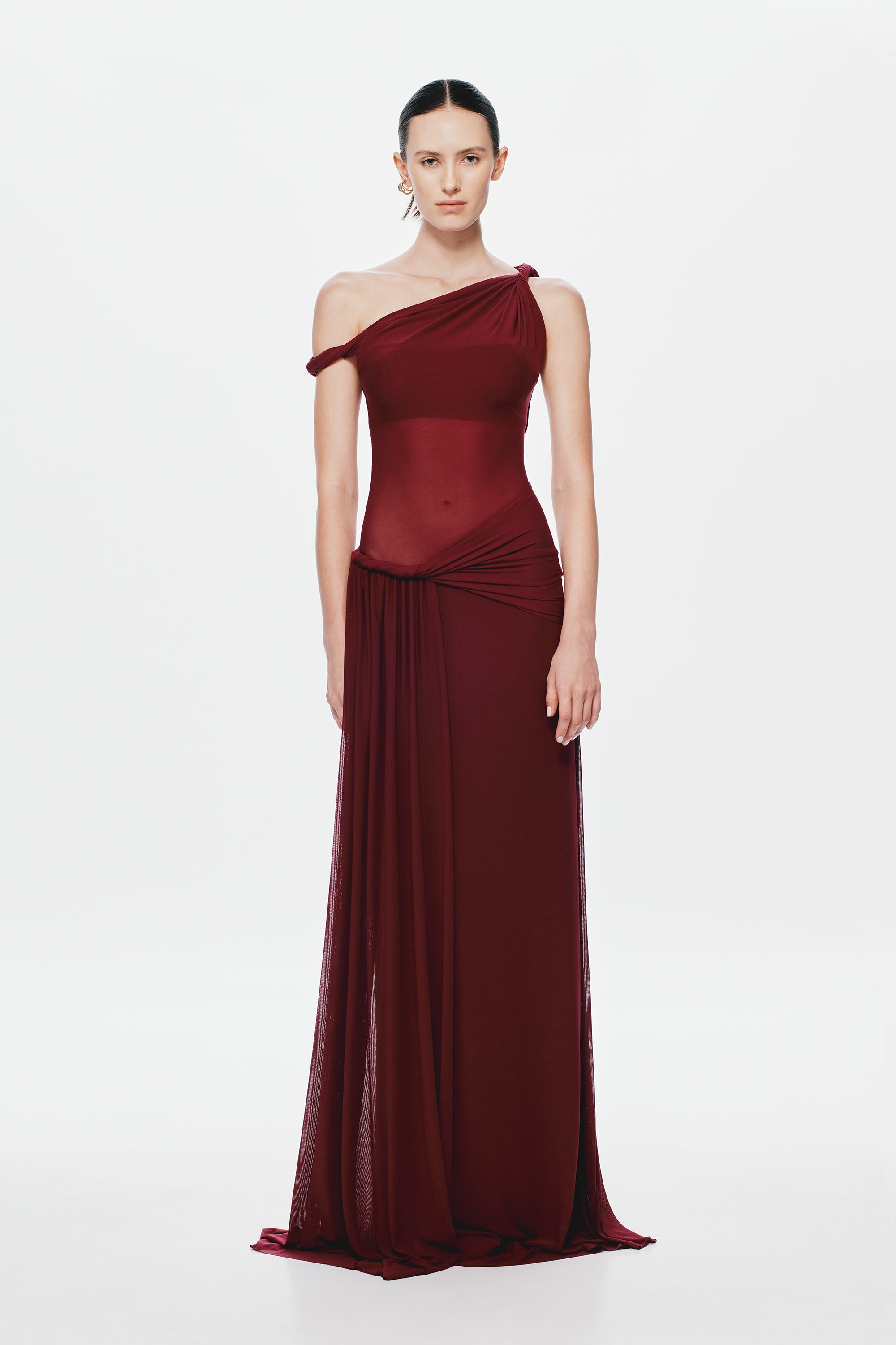 Maroon one-shoulder draped maxi dress with ruched waist and flowing sheer skirt