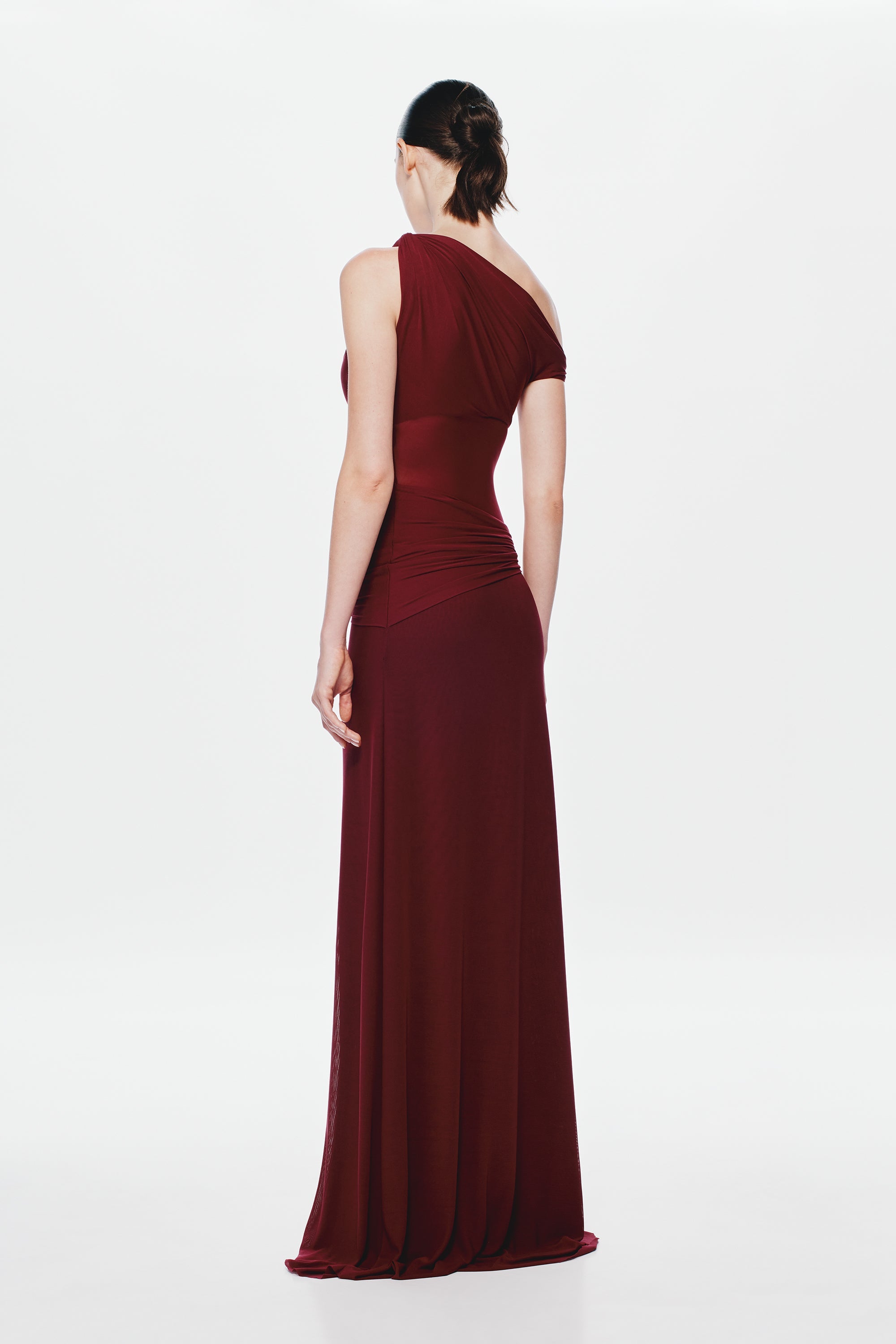 Maroon one-shoulder maxi dress with draped back and fitted waist