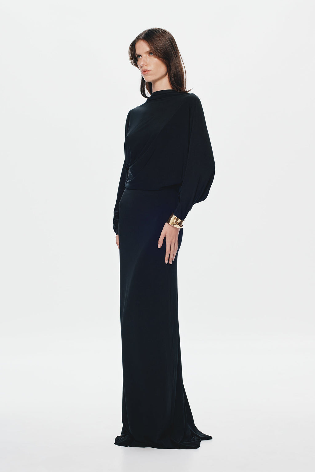 Black jersey maxi dress with high neck, long sleeves, waist belt