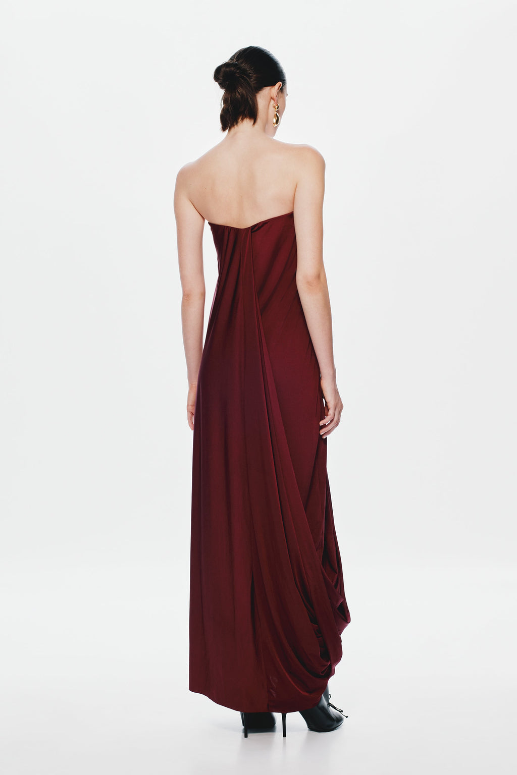 Burgundy strapless maxi jersey dress with ruched back seam and flowing drape