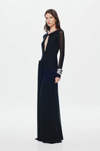 Black mesh maxi dress with long sleeves, fitted waist, and oval front cutout