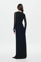 Black mesh maxi dress with sheer back, long sleeves, and fitted maxi length