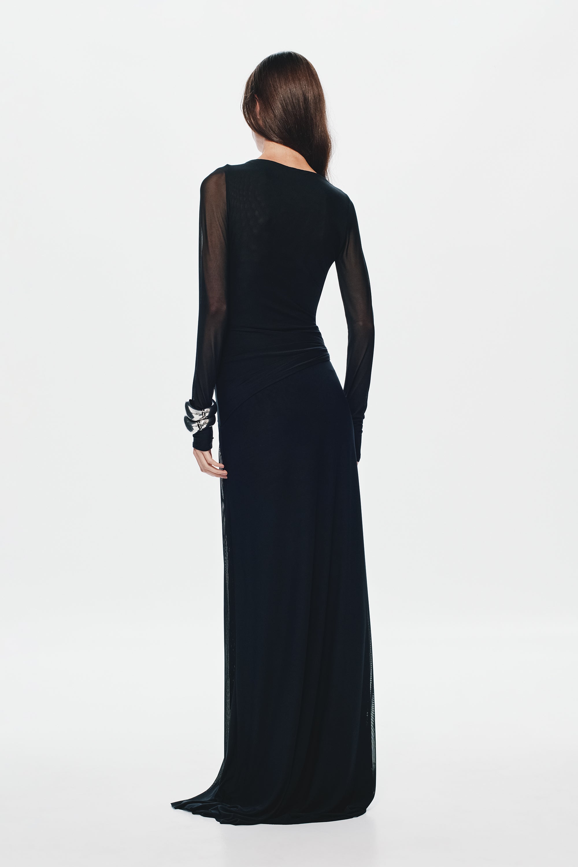 Black mesh maxi dress with sheer back, long sleeves, and fitted maxi length