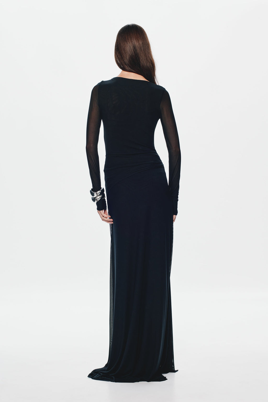 Black mesh maxi dress with sheer back drape, long sleeves, and fitted waist