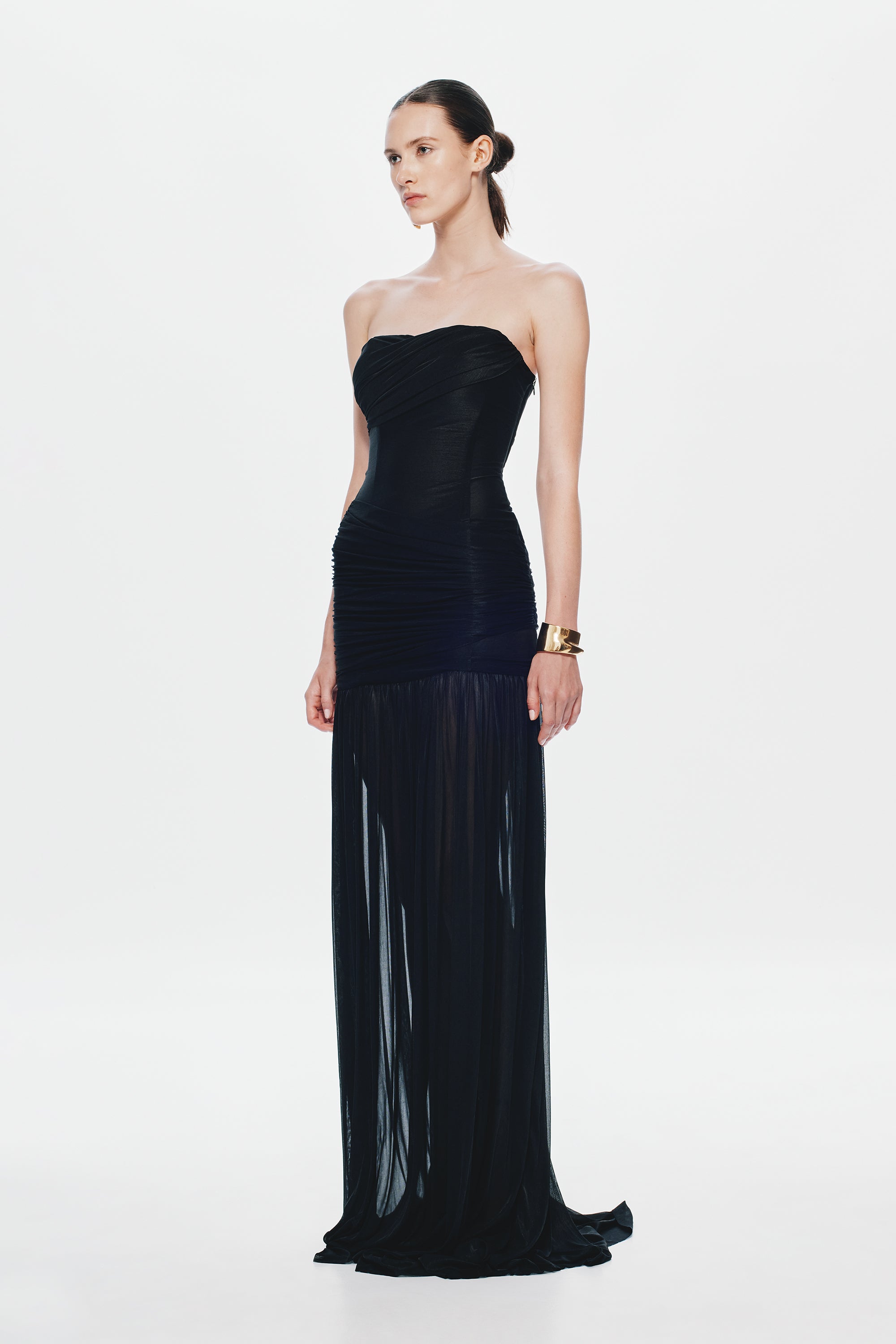 Black strapless maxi dress with ruched bodice and flowing tiered skirt