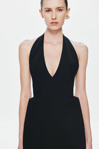 Black sleeveless suiting dress with deep V-neck front and fitted waist
