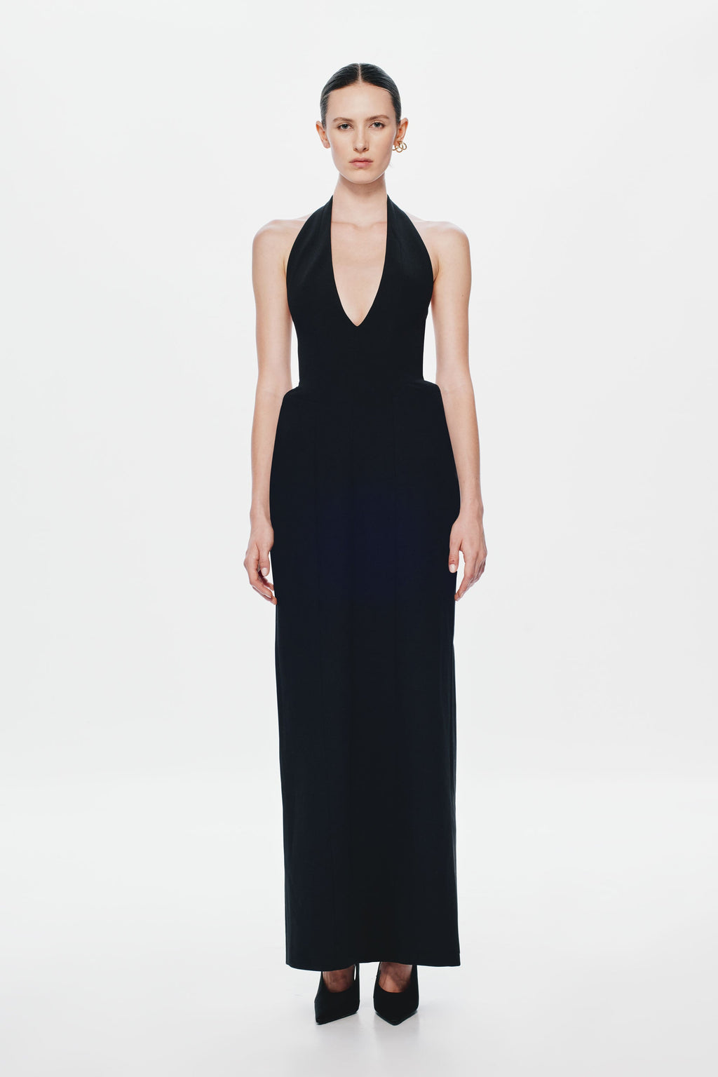 Black sleeveless halter suiting dress with deep V-neck and floor-length column fit
