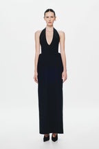 Black sleeveless halter suiting dress with deep V-neck and floor-length column fit