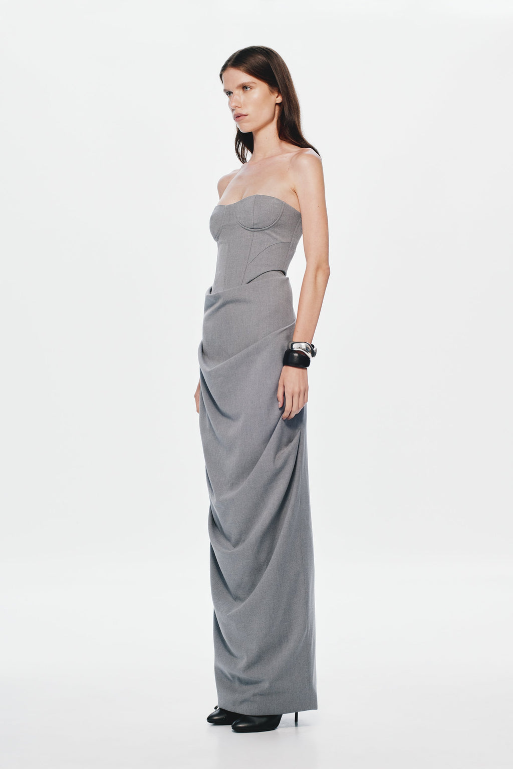 Grey strapless bustier with curved bust cups and draped longline fit