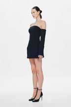 Black off-shoulder mini dress with long sleeves; side view shows fitted bodice