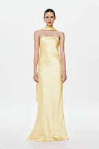 Soft yellow satin halter dress with strapless neckline, long column silhouette