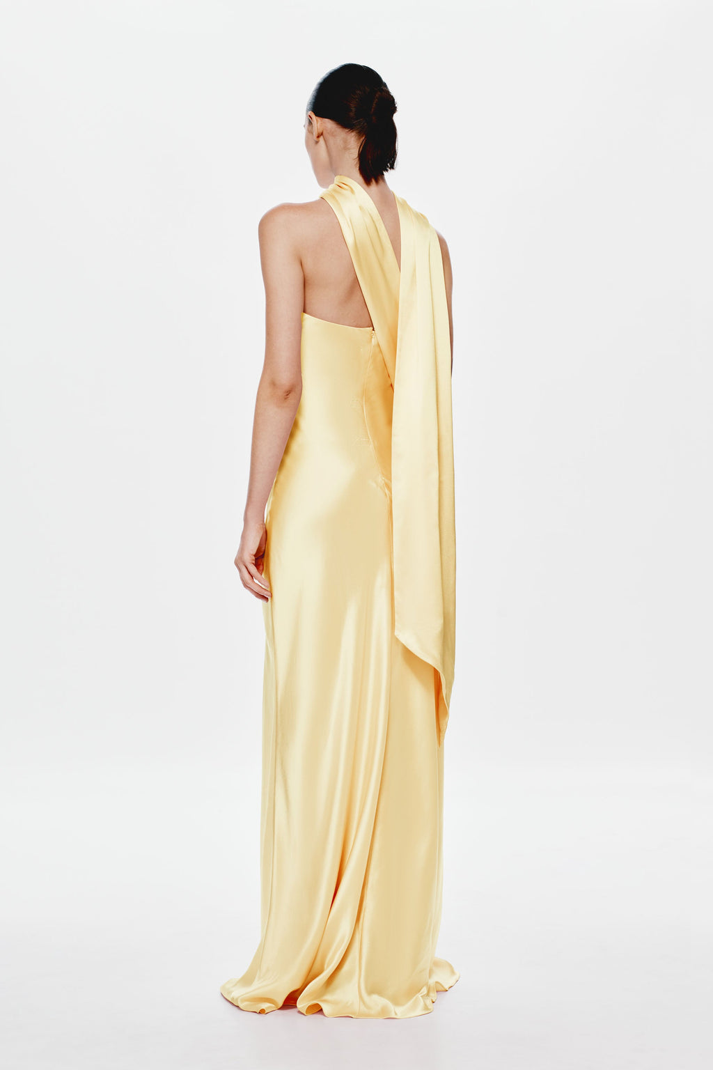 Soft yellow satin halter dress with draped back panel, long column silhouette