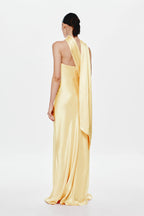 Soft yellow satin halter dress with draped back panel, long column silhouette
