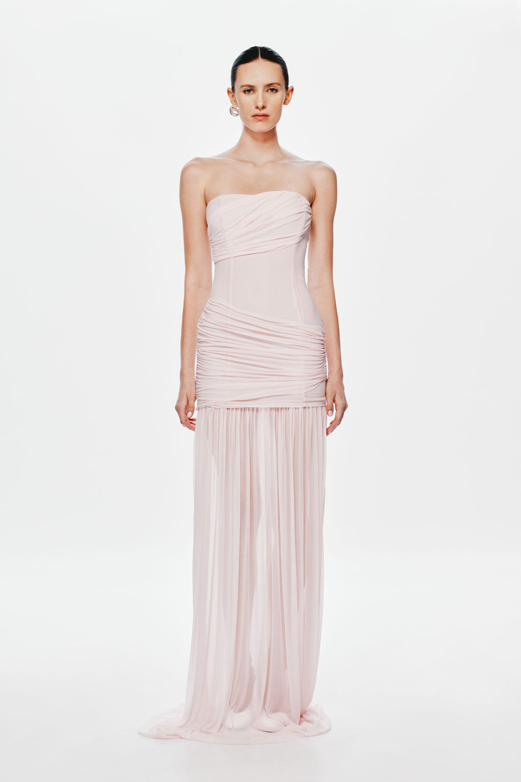 Dusty pink strapless maxi dress with gathered waist, draped bodice, and pleated sheer skirt