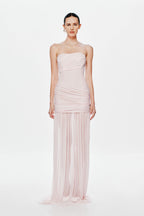 Dusty pink strapless maxi dress with gathered waist, draped bodice, and pleated sheer skirt