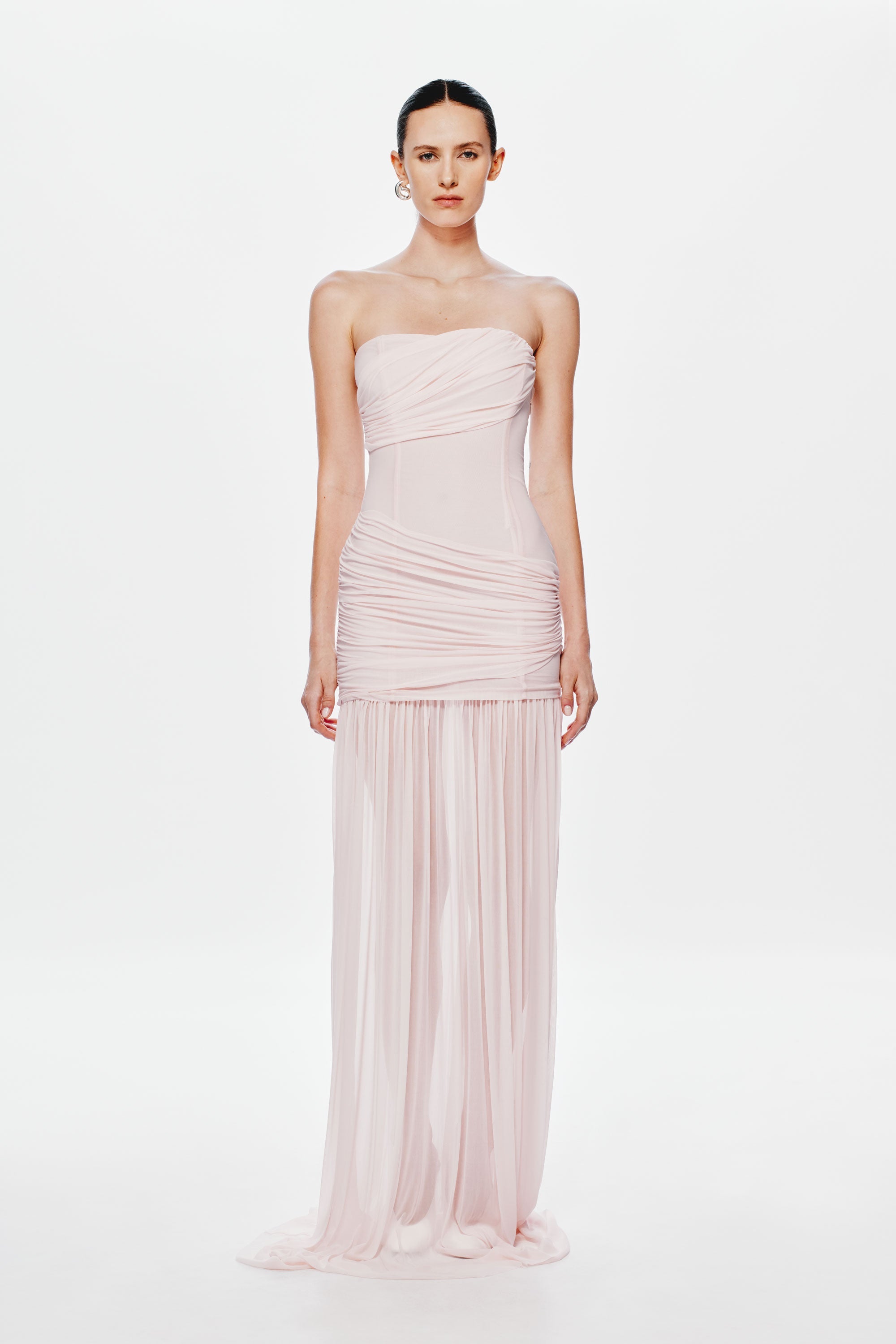 Dusty pink strapless maxi dress with gathered waist, draped bodice, and pleated sheer skirt