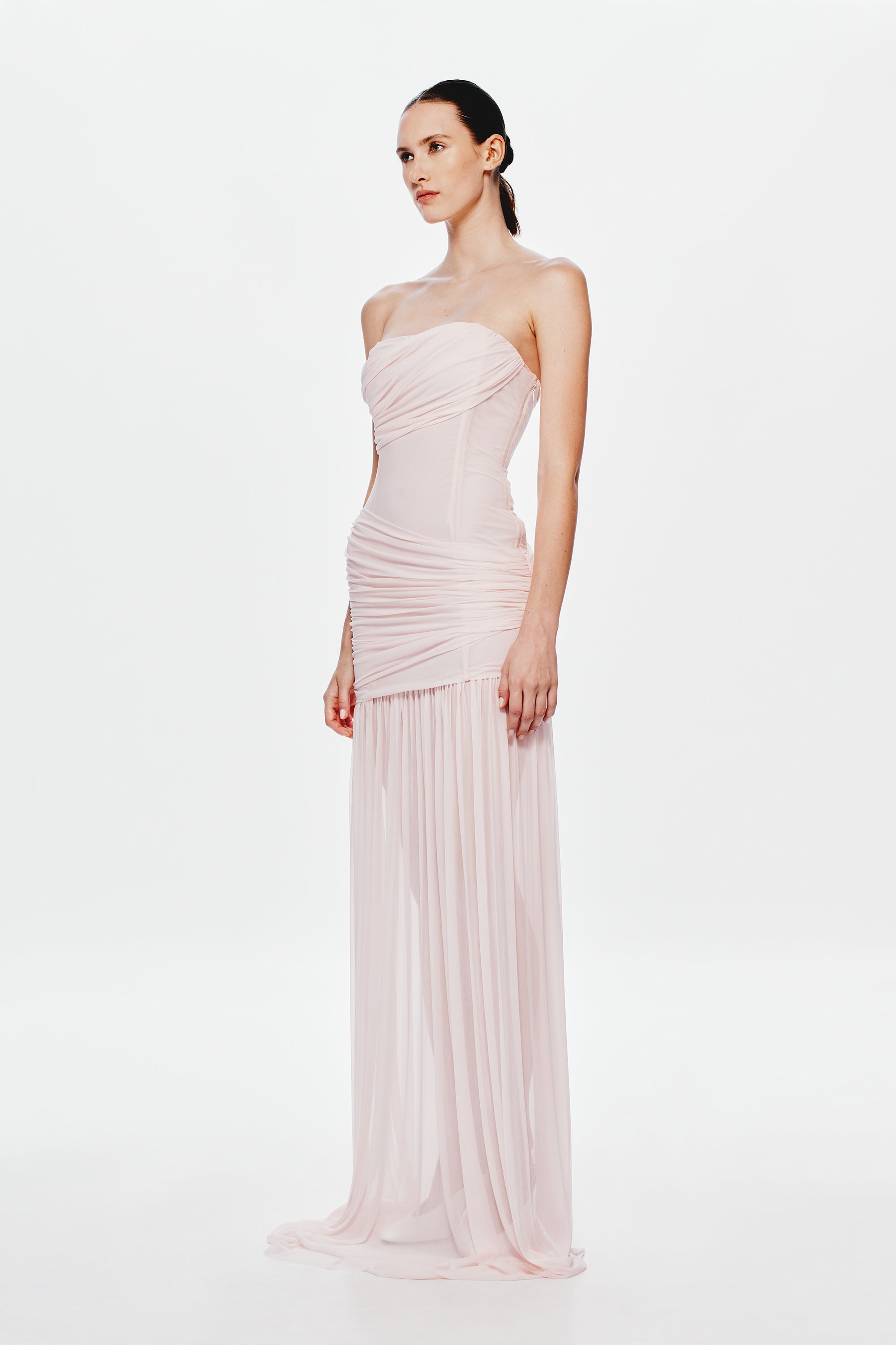 Dusty pink strapless maxi dress with ruched side detailing and flowing pleated sheer skirt