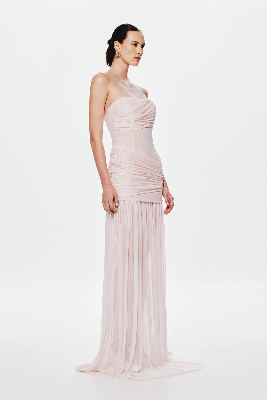 Dusty pink strapless maxi dress with draped wrap front and pleated sheer skirt