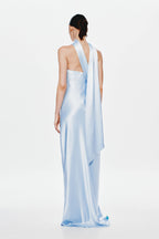 Light blue satin open-back maxi dress with halter strap and draped back panel.