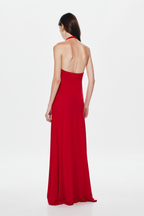 Back view of cherry red halter cupro dress with open back and long pleated skirt