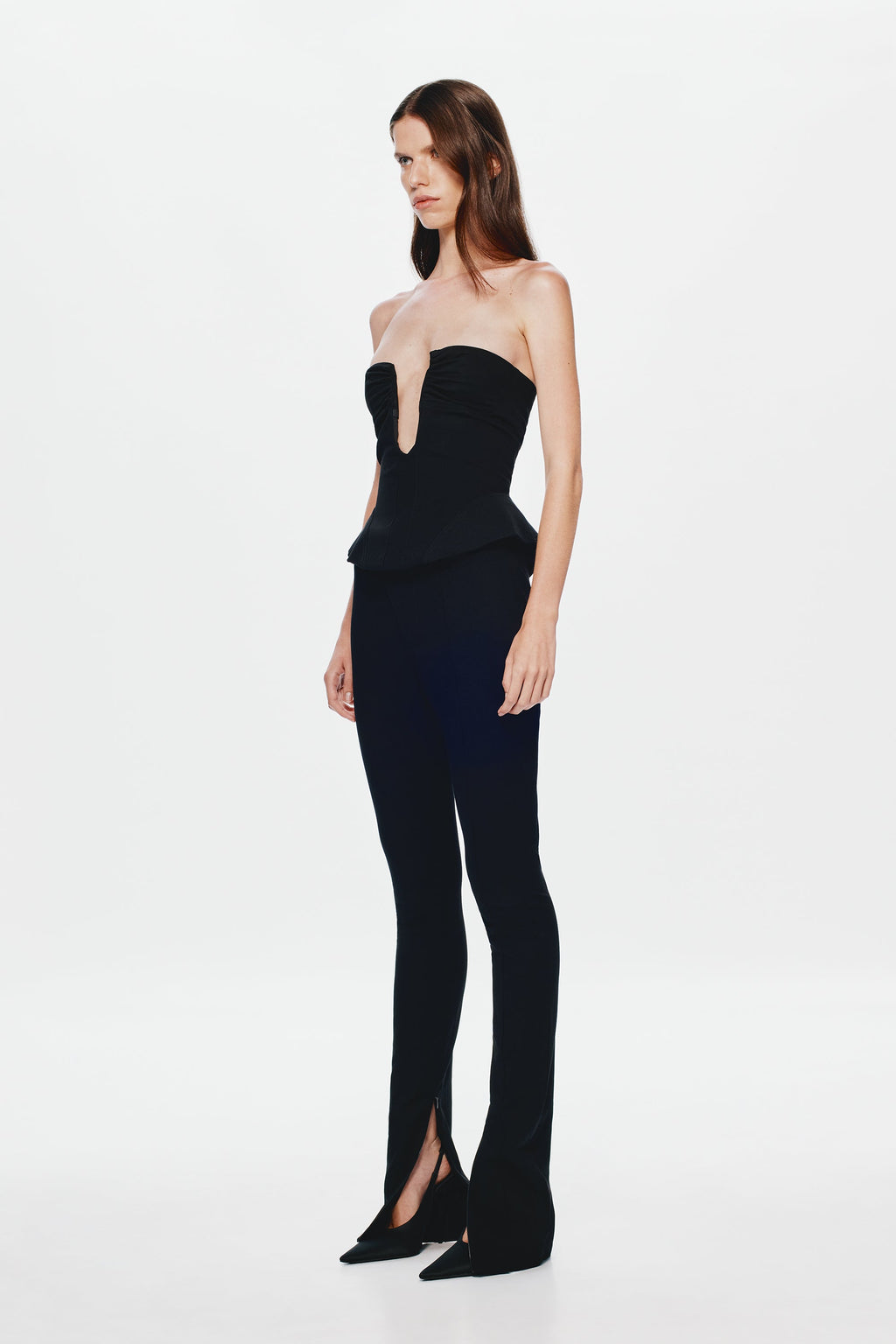 Black strapless corset top with keyhole neckline and peplum waist, side view