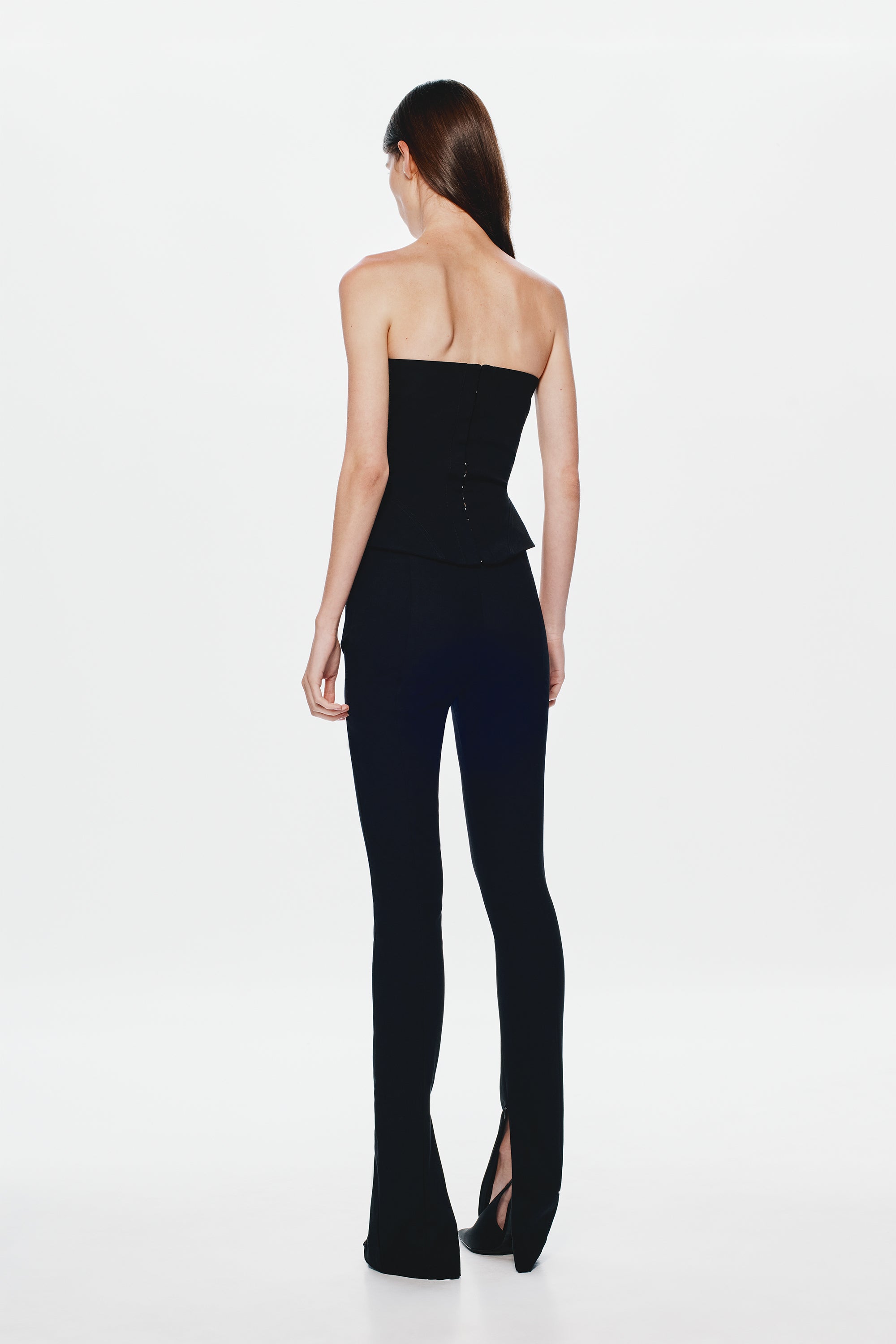 Black strapless corset top with corset seams and back panel stitching