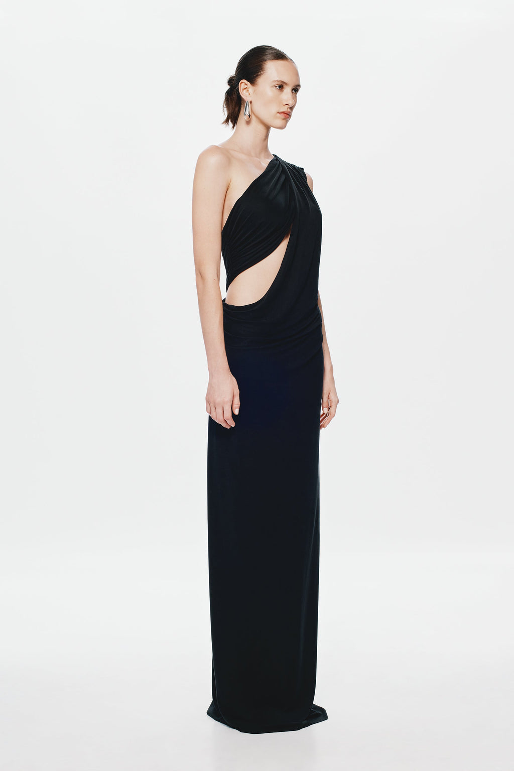 Black asymmetrical one-shoulder maxi dress with draped neckline, fitted column