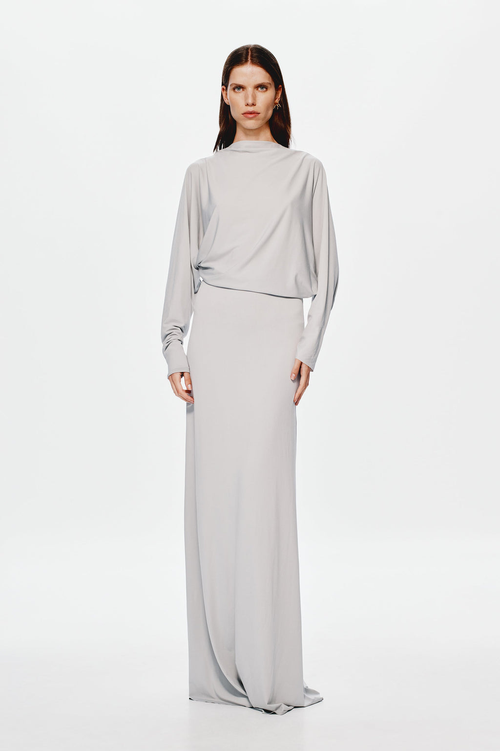 Grey jersey maxi dress with high neckline, long sleeves, and belted waist seam