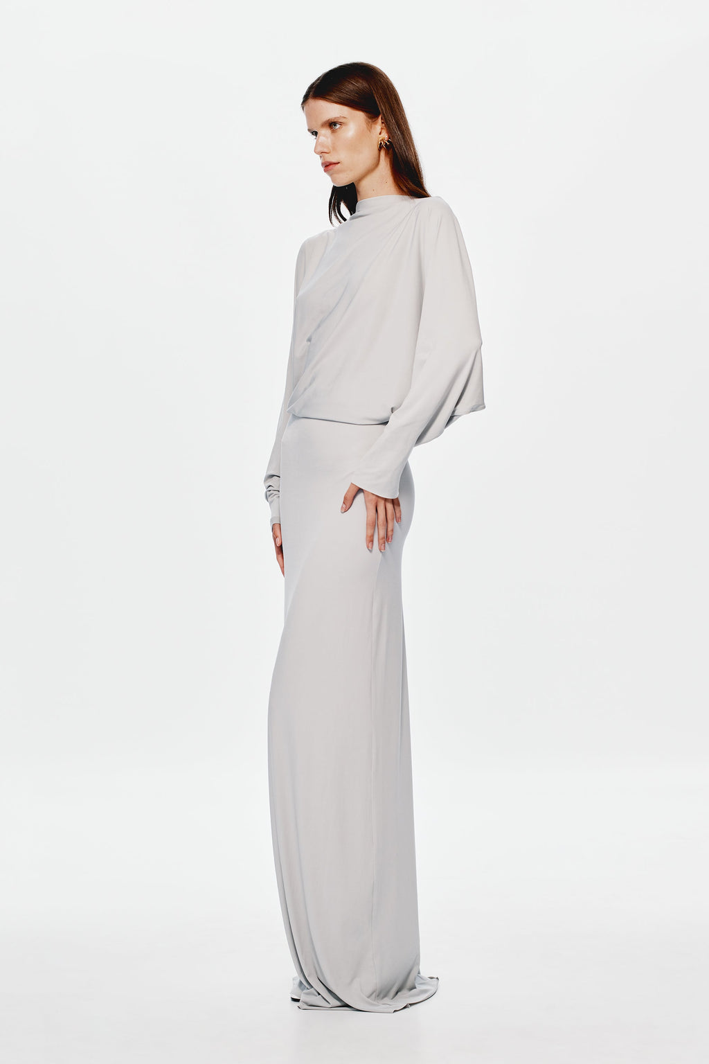 Grey jersey maxi dress with high neck, long sleeves, and draped waist