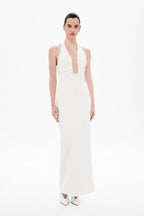 Ivory halter maxi dress with deep keyhole neckline and fitted column silhouette.