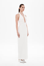 Ivory halter maxi dress with deep V keyhole front and sleeveless straight skirt.