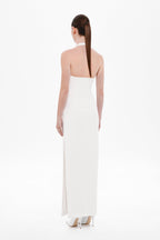 Ivory halter maxi dress, open back with racerback straps and long column skirt.