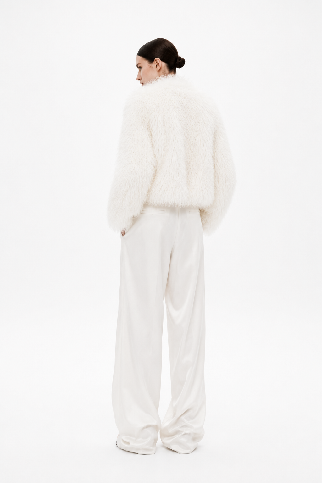 Ivory shearling coat with relaxed fit and button closure, back view