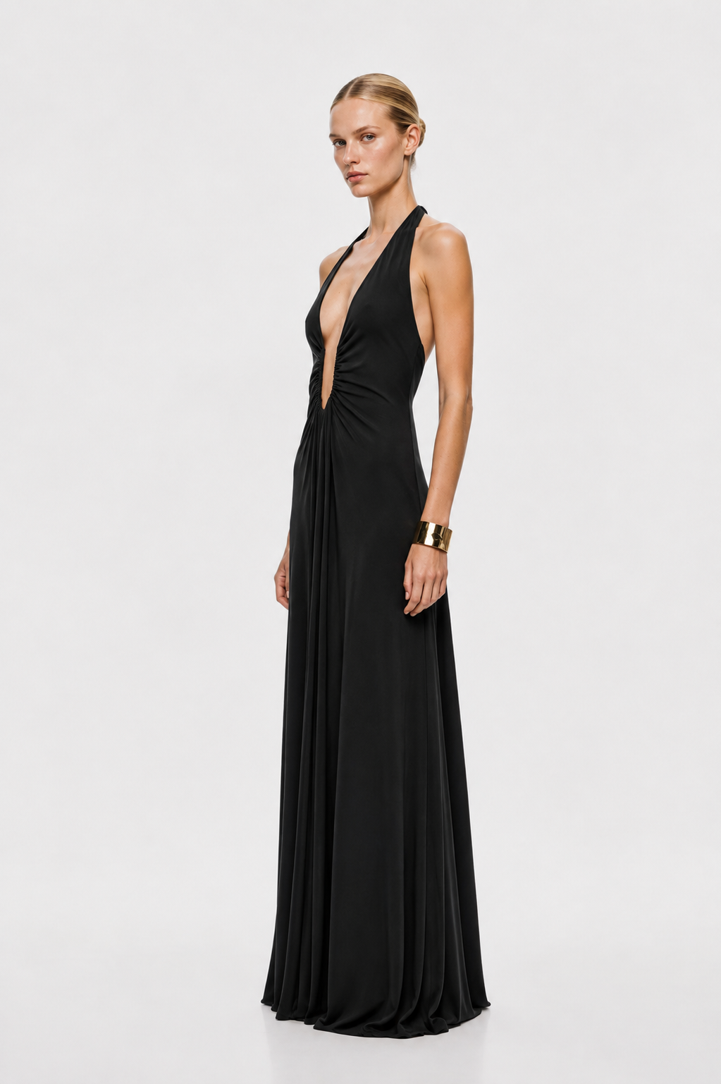 Black sleeveless deep V cupro dress with ruched waist and flowing pleated maxi skirt