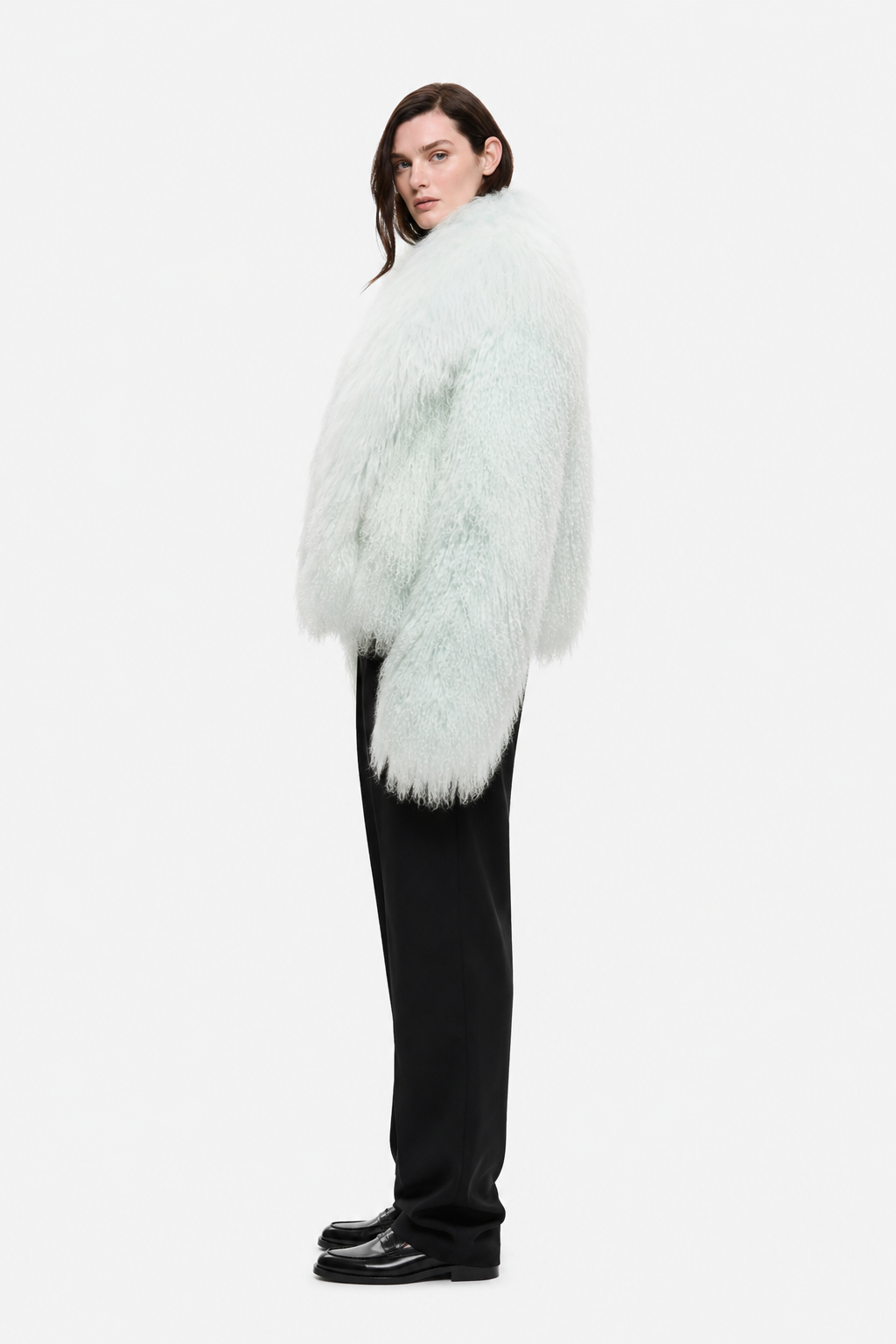 Pale mint shearling jacket with fluffy texture and open front, side view