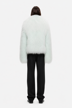 Pale mint shearling jacket with open back and long sleeves, fuzzy shag texture