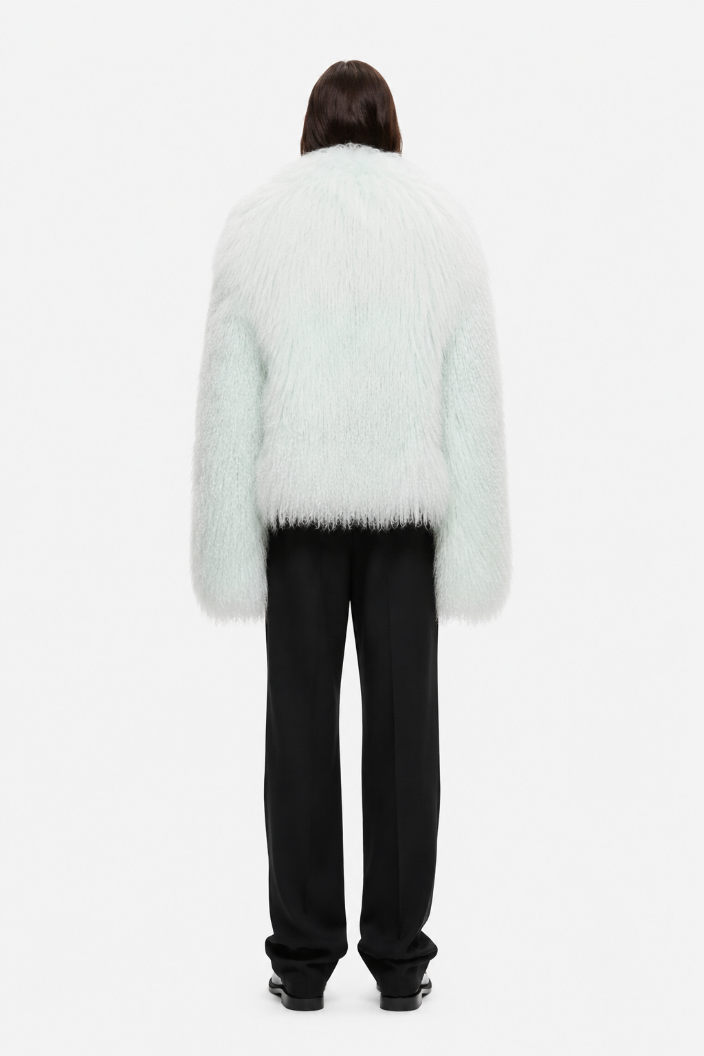 Pale mint shearling jacket with open back and long sleeves, fuzzy shag texture
