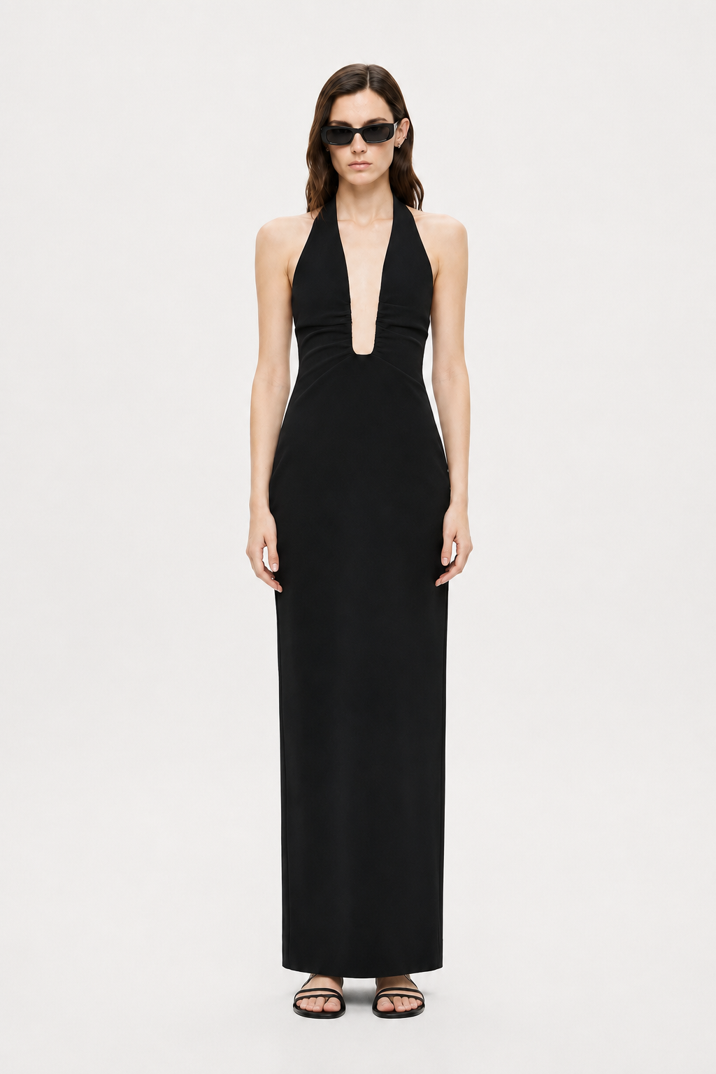 Black sleeveless halter maxi dress with deep V neckline