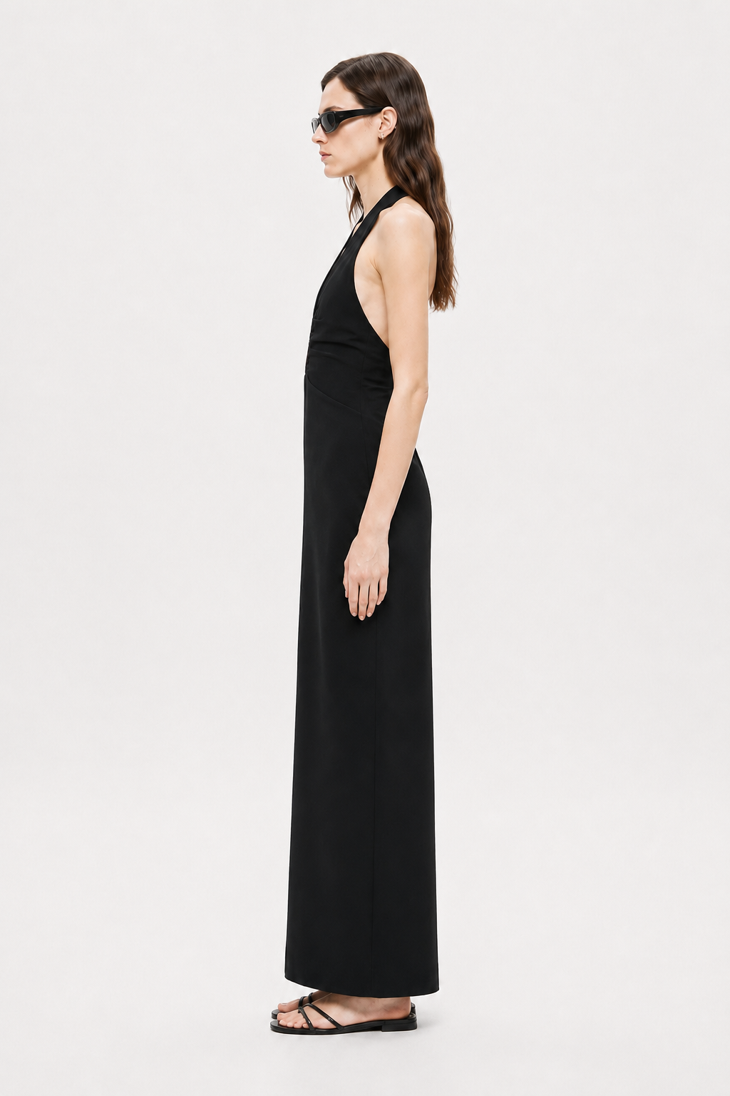 Black sleeveless halter maxi dress with open-back V panel, side view